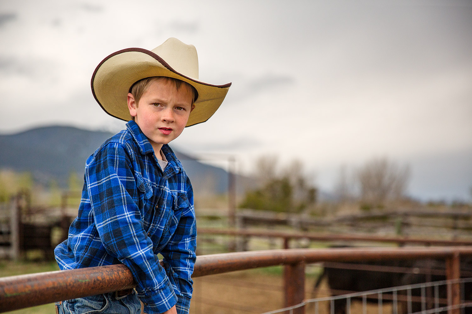 STYLE SELECTIONS Sales -US Shoe Sales 2024 Young Cowboy Standing on Edge Corral
